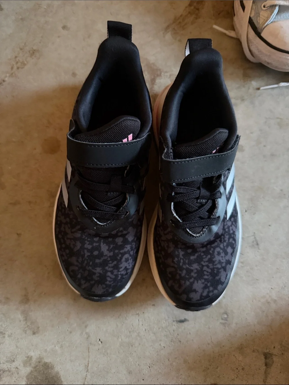 Adidas Girl’s black Sneakers with Pink Accent